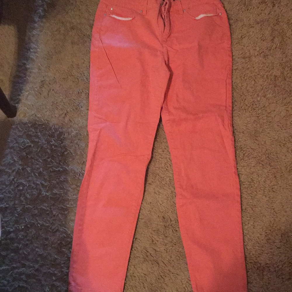 Bright peach colored jeans